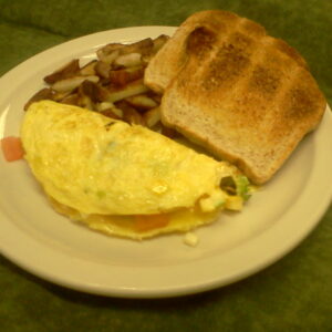 Veggie omelette with toast and home fries